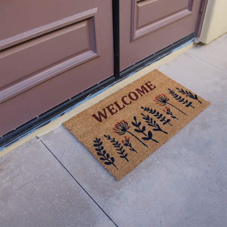 WildflowerMeadow Action 02 750x750 1 Wildflower Meadow Welcome Doormat in front of door