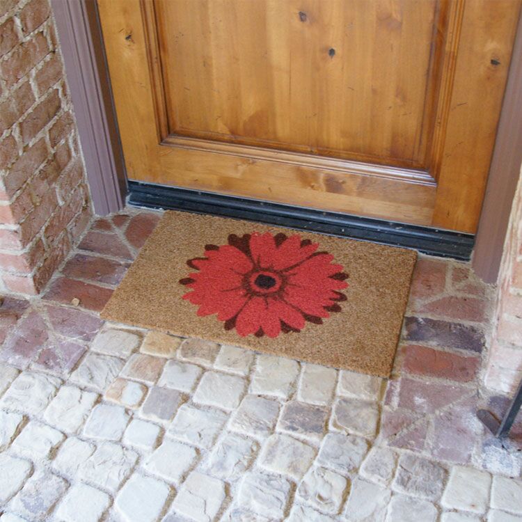 red_daisy_action2_Large brown door mat with a red daisy design in front of brown light door