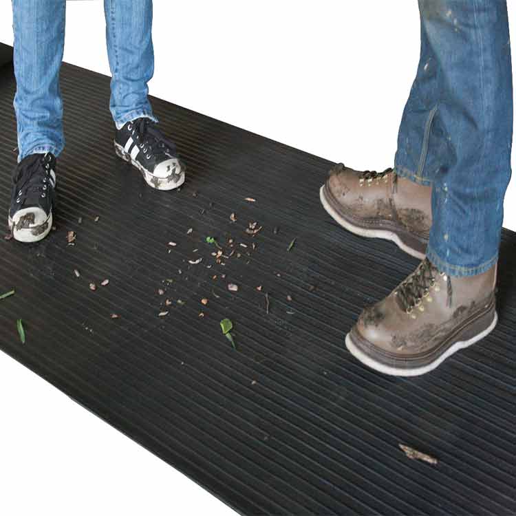 Corrugated_Wide_Rib_Action2_Large Black in color Indoor/Outdoor Slip-Resistant Rubber Floor Runners two people standing