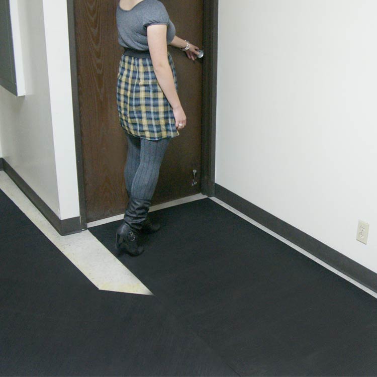 Ramp_Cleat_Action3_Large Black in color Perfect Anti-Slip Mats for Inclines, Ramps, and Walkways woman standing