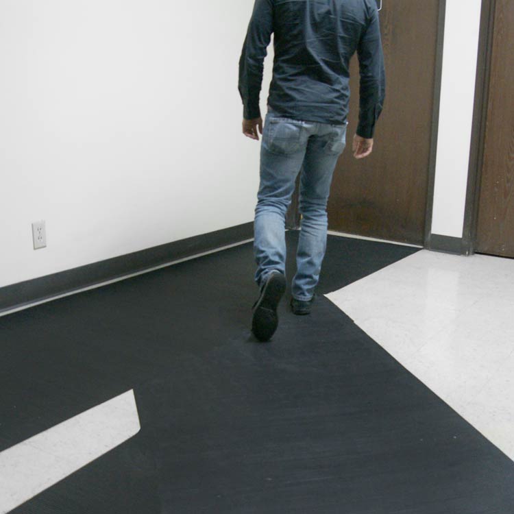 Ramp Cleat Black in color Perfect Anti-Slip Mats for Inclines, Ramps, and Walkways person walking