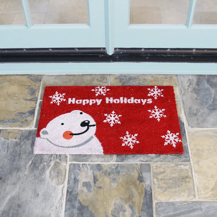 happy-holidays-doormat-22-action_Large Happy Holidays written in white text with a white bear next to it and snowflakes