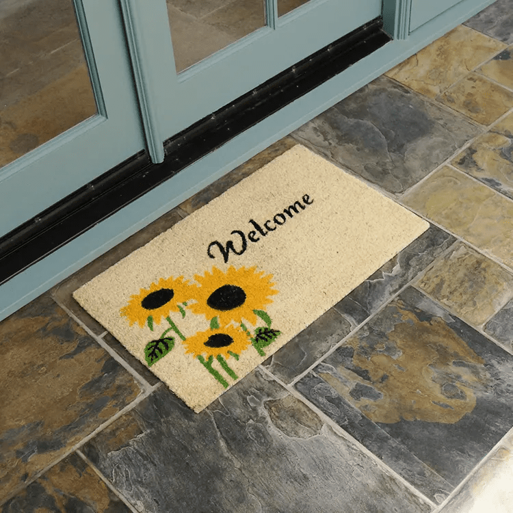 sunflower-02-action_Large copy Welcome mat with sunflower design in front of white double door