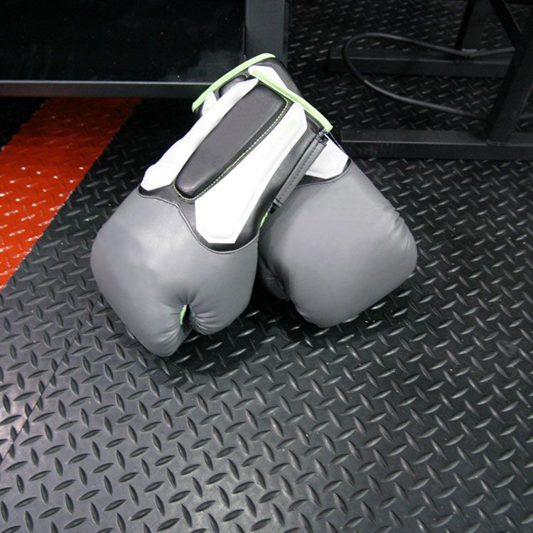 Diamond Plate Action5b Large diamond plate underneath a pair of gray boxing gloves
