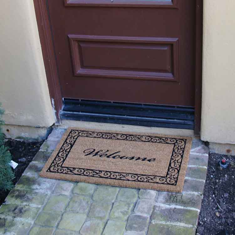 Estate_Style_Action2_Large Welcome mat in front of an entrance