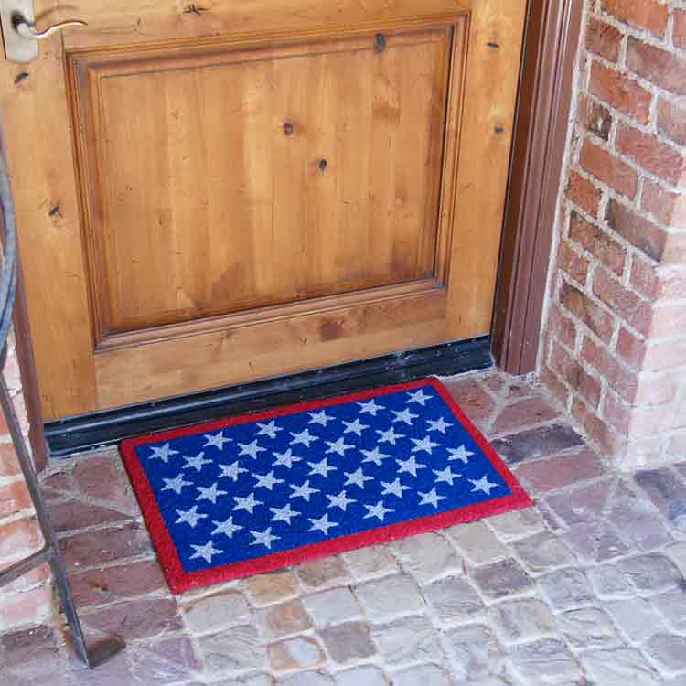 red-white-blue-patriotic-01-action_Large Red, white, and blue Patriotic doormat representing the American flag in front of light brown door