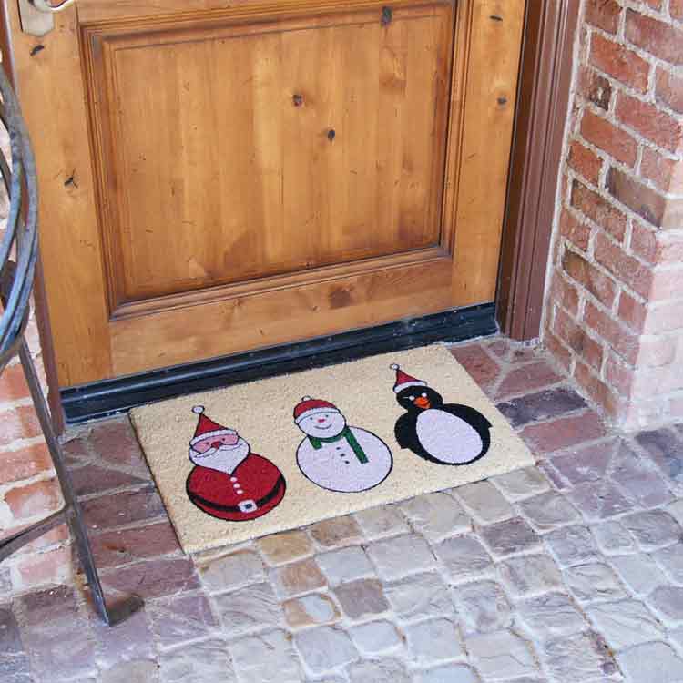 The Festive doormat with picture of Santa a snowman and a penguin