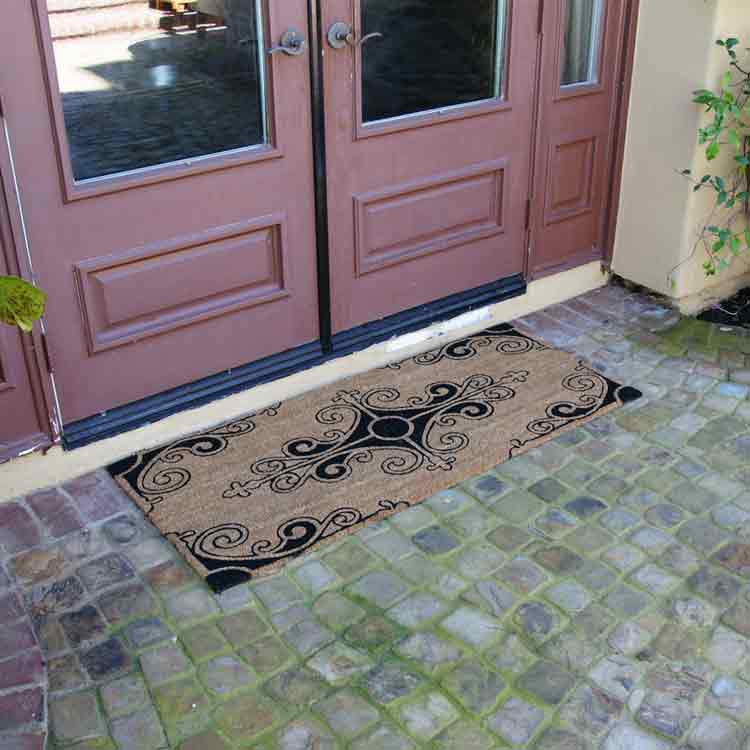 Traditional_Fleur_Action_01_Large Traditional Fleur de Lis French Mat in front of brown double door