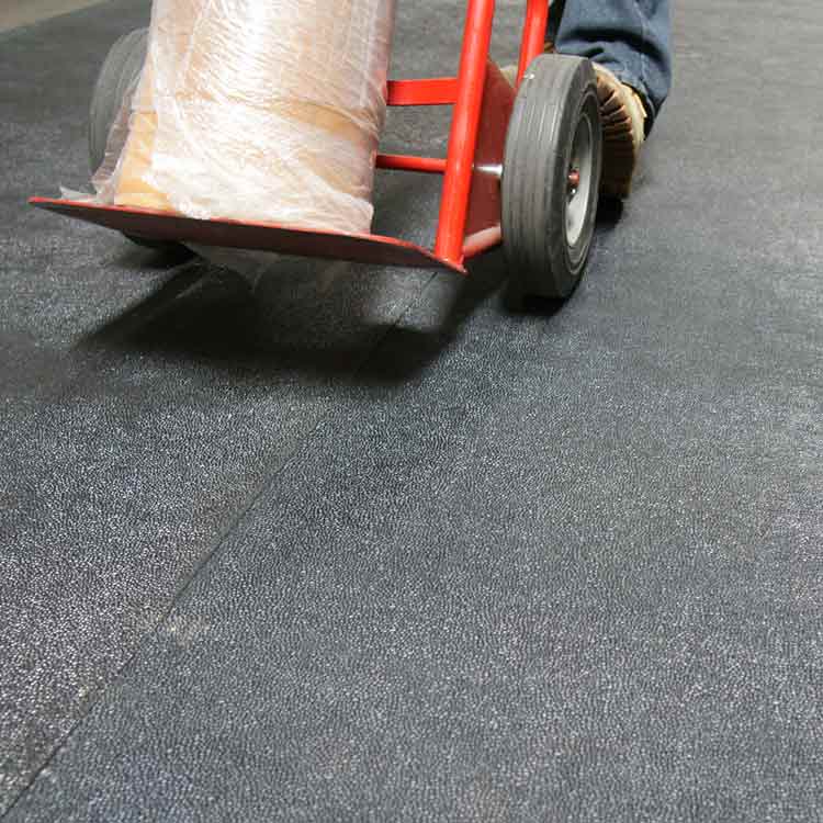 Tuff_N_Lastic_Action_Shot_1C_Large Black color Reclaimed Safety Rubber Mat Improves Traction and Resilience can roll trolly on it