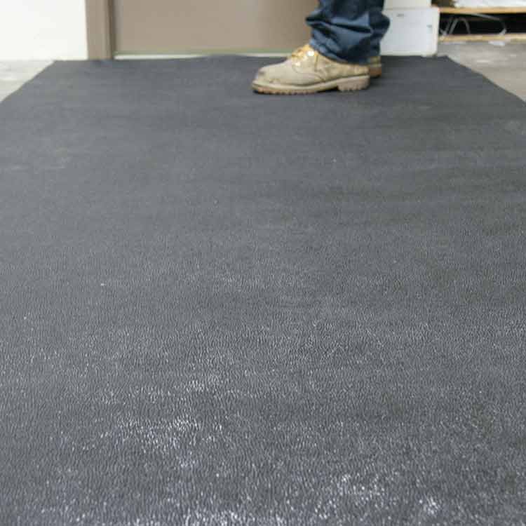 Tuff N Lastic Action Shot 2B Large Black color Reclaimed Safety Rubber Mat Improves Traction and Resilience man standing