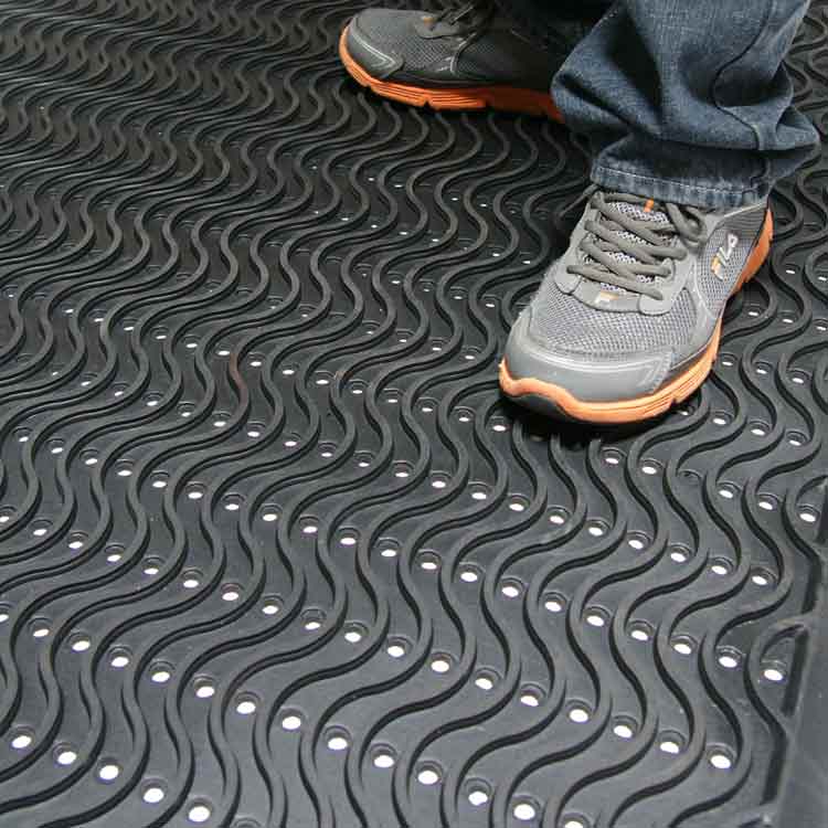 Ultra Scraper Action Shot 1B Large Black Color Commercial Entrance Mat, Promotes Safety and Slip-Protection man standing