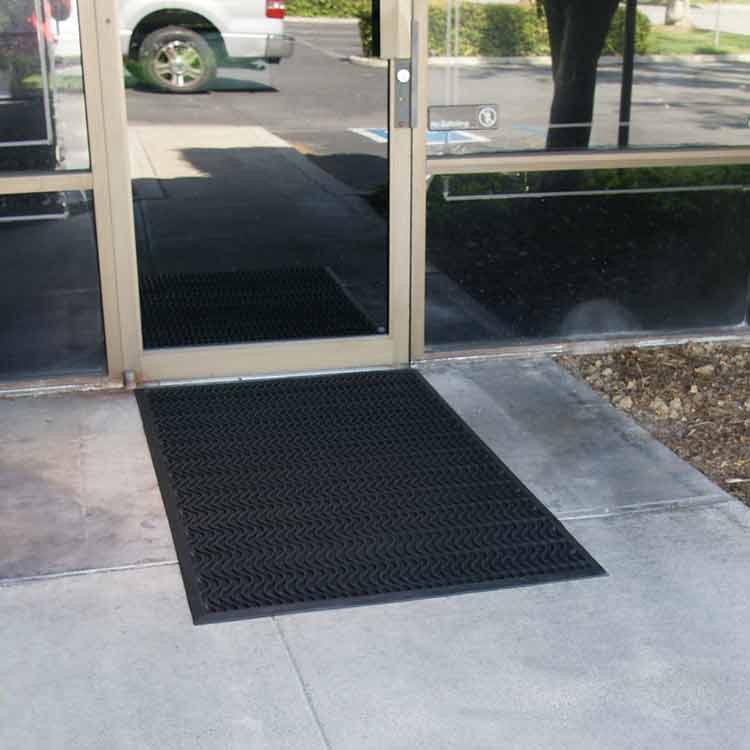 Ultra_Scraper_Action_Shot_2B_Large Black Color Commercial Entrance Mat, Promotes Safety and Slip-Protection at front door