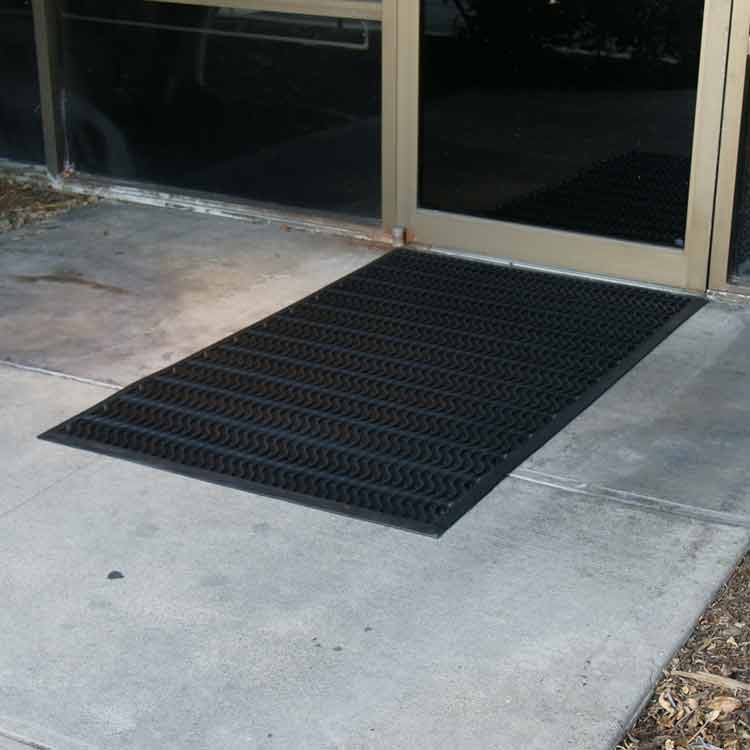 Ultra_Scraper_Action_Shot_2C_Large Black Color Commercial Entrance Mat, Promotes Safety and Slip-Protection good for outdoor
