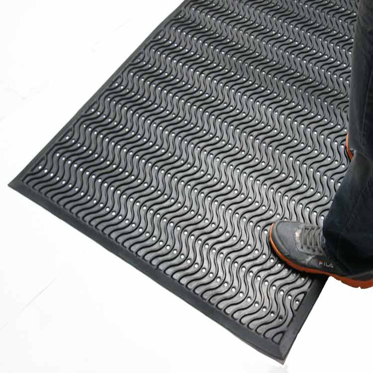 Ultra_Scraper_Action_Shot_3B_Large Black Color Commercial Entrance Mat, Promotes Safety and Slip-Protection man standing