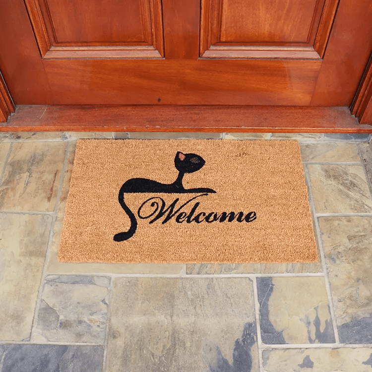 “Kitty Cat Welcome Mat” Welcome written in middle with a cat above it brown mat